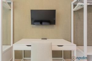 TV a/nebo společenská místnost v ubytování Einaudi Guesthouse by Apulia Accommodation
