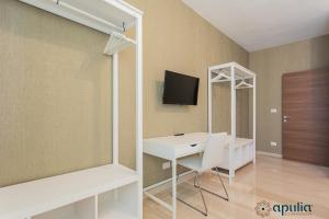 TV a/nebo společenská místnost v ubytování Einaudi Guesthouse by Apulia Accommodation