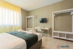 Postel nebo postele na pokoji v ubytování Einaudi Guesthouse by Apulia Accommodation