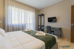 Postel nebo postele na pokoji v ubytování Einaudi Guesthouse by Apulia Accommodation