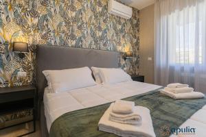Postel nebo postele na pokoji v ubytování Einaudi Guesthouse by Apulia Accommodation