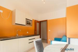 Postel nebo postele na pokoji v ubytování Einaudi Guesthouse by Apulia Accommodation