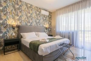 Postel nebo postele na pokoji v ubytování Einaudi Guesthouse by Apulia Accommodation