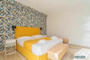 Postel nebo postele na pokoji v ubytování Einaudi Guesthouse by Apulia Accommodation