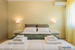 Postel nebo postele na pokoji v ubytování Einaudi Guesthouse by Apulia Accommodation