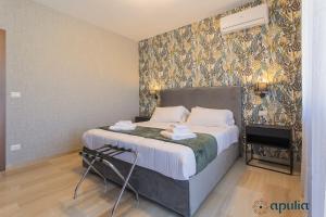 Postel nebo postele na pokoji v ubytování Einaudi Guesthouse by Apulia Accommodation