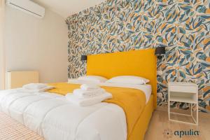 Postel nebo postele na pokoji v ubytování Einaudi Guesthouse by Apulia Accommodation
