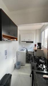 Een keuken of kitchenette bij Apartamento aconchegante PG