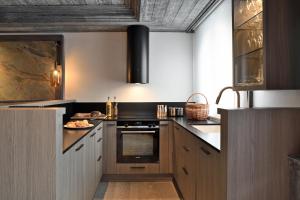Les 2 chalets - Les appartements du Stratoにあるキッチンまたは簡易キッチン