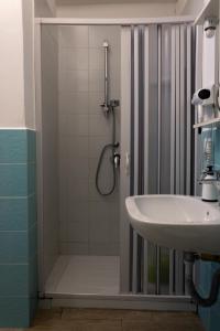 a bathroom with a shower and a sink at Affittacamere le scale in Castellammare del Golfo