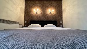 En eller flere senge i et værelse på Apartment on Nauki Avenue 102