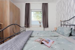 Ein Bett oder Betten in einem Zimmer der Unterkunft Bungalow "Wiesenblick"