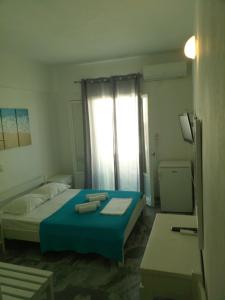 Ein Bett oder Betten in einem Zimmer der Unterkunft Frangiscos