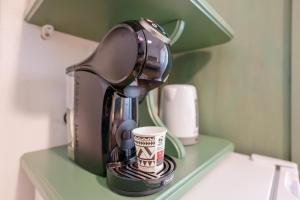 a coffee maker is sitting on a shelf at NonnAdele in Iglesias