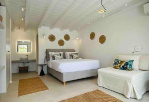 Ένα ή περισσότερα κρεβάτια σε δωμάτιο στο Villa Elia Breeze Mykonos +48 φωτογραφίες