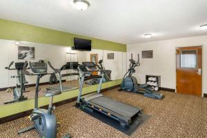 a gym with several exercise bikes in a room at Sleep Inn in Hickory