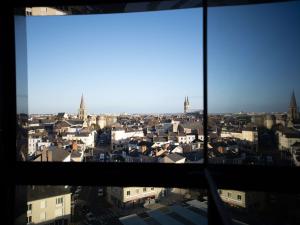 a view of a city from a window at Novotel Angers Centre Gare in Angers