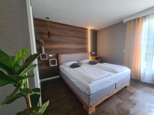 Postel nebo postele na pokoji v ubytování Vila Privilege Felix