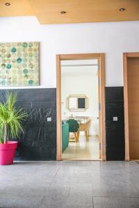 een hal met een deur naar een woonkamer bij YourPlace - Luxury - Prestigia Hay Riad in Rabat