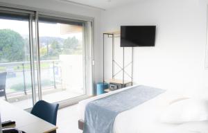 Postel nebo postele na pokoji v ubytování Tiercé Hotel