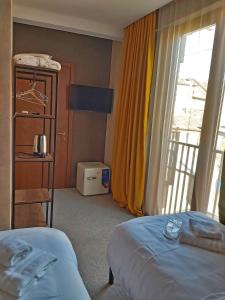 Postel nebo postele na pokoji v ubytování Green Inn Hotel