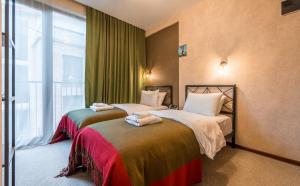 Postel nebo postele na pokoji v ubytování Green Inn Hotel
