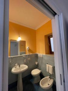 a bathroom with a sink and a toilet at B&B Lunaponzese-Ponza centro in Ponza +6 photos