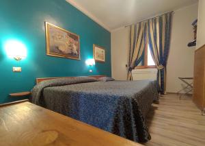 Voodi või voodid majutusasutuse Hotel Santa Croce toas