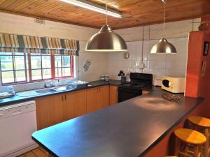 a kitchen with a large counter top in a room at Hill Billys Selfcatering in Winterton