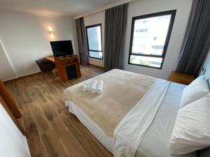 Postel nebo postele na pokoji v ubytování Flat REFORMADO em hotel no Jardins