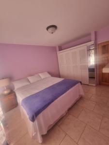 Postel nebo postele na pokoji v ubytování Diamond Cut Villa and Suites + 11 fotografií