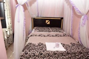 Katil atau katil-katil dalam bilik di Madola Hotel