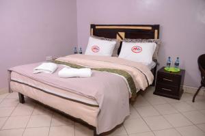 Katil atau katil-katil dalam bilik di Madola Hotel