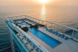 an aerial view of a cruise ship in the ocean at Sea-View Studio with Beach Access in Ras al Khaimah