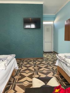Voodi või voodid majutusasutuse Zangu Hotel toas