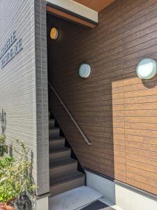 a set of stairs on the side of a building at Anabelle Residence Japan in Kawagoe