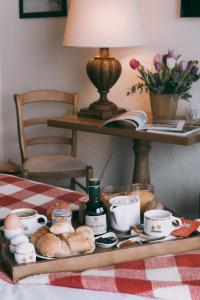 a tray of bread and eggs on a table at Hôtel Alpen Ruitor in Méribel