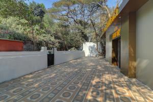 an empty walkway in front of a building at Hotel Sion Fort in Mumbai