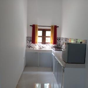 a kitchen with a sink and a window at Villa in Yakkala, Gampaha 