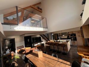 an overhead view of a living room with tables and chairs at Villa au Gré du Vent in Bray-Dunes