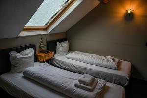 Postel nebo postele na pokoji v ubytování Hotel Oostereiland