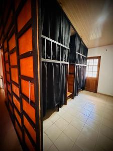 a locker room with black curtains and a door at Blasina el valle in Valle de Anton