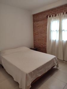 Una cama o camas en una habitación de Luna de Cuarzo