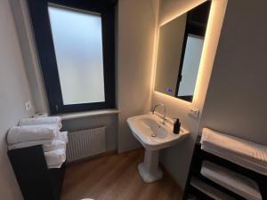 a bathroom with a sink and a mirror at House 74 in Verona