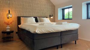 Postel nebo postele na pokoji v ubytování B&B Kuiper in Friesland