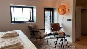 Postel nebo postele na pokoji v ubytování B&B Kuiper in Friesland
