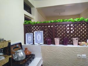 a counter with purple and white containers on it at Casa di Medina - Authentic Stay with Parking in Tiznit
