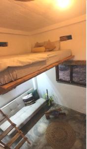 a bedroom with a bunk bed in a room at Marshmallow Homestay in Ahangama