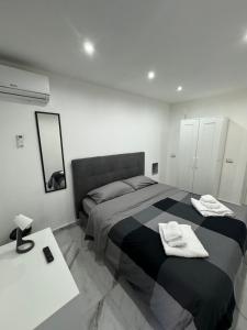 Ένα ή περισσότερα κρεβάτια σε δωμάτιο στο Carlant Apartment