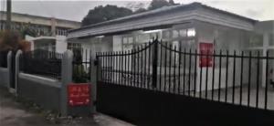 a black fence in front of a house at An&Sy Family House in Surinam +9 photos